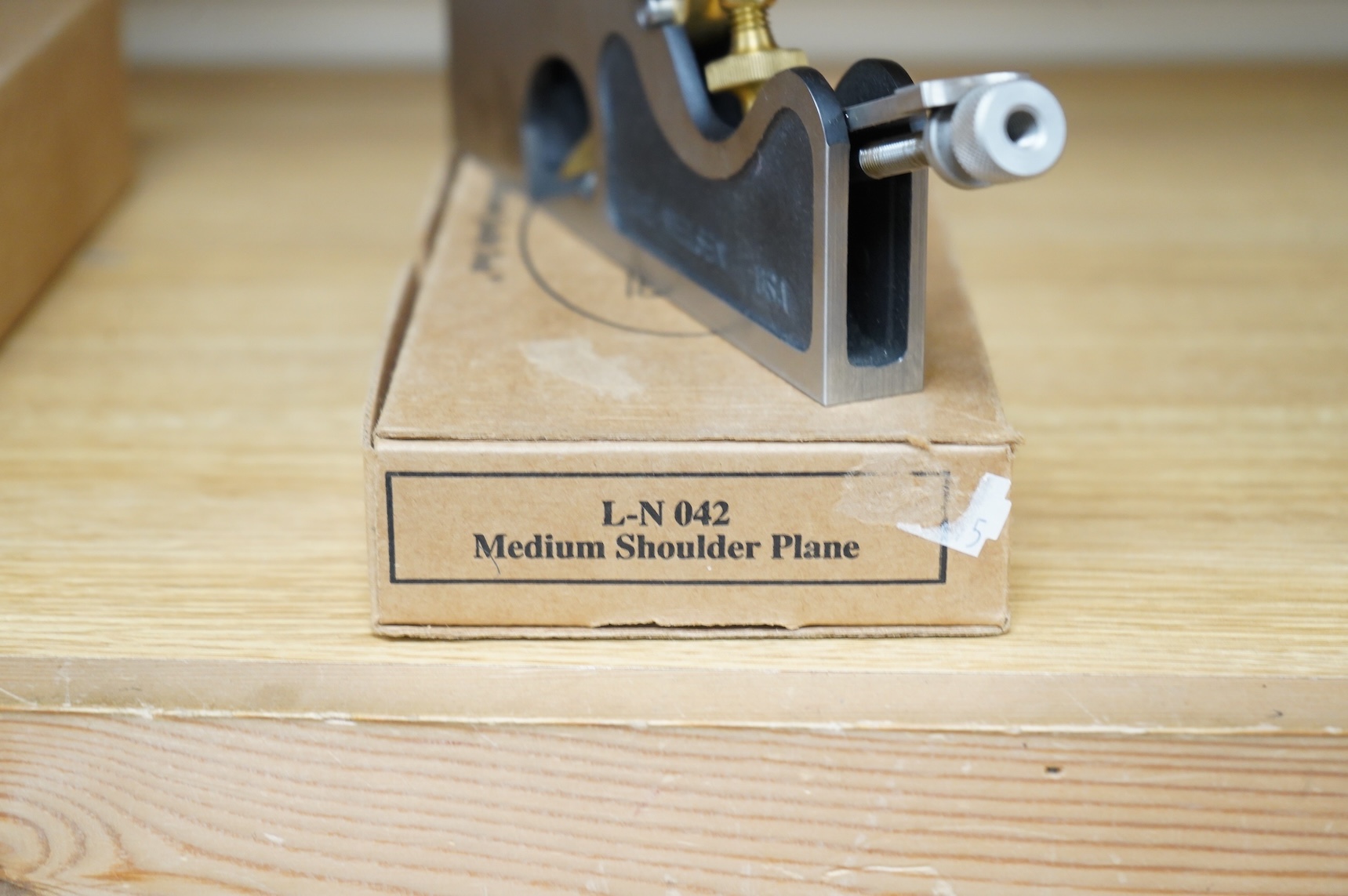 A boxed Lie-Nielsen Toolworks medium shoulder plane (L-N 042) with paperwork